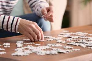 Partially completed crossword or puzzle symbolizing cognitive struggle.