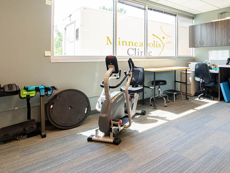 Rehabilitation therapy room with equipment at Minneapolis Clinic of Neurology